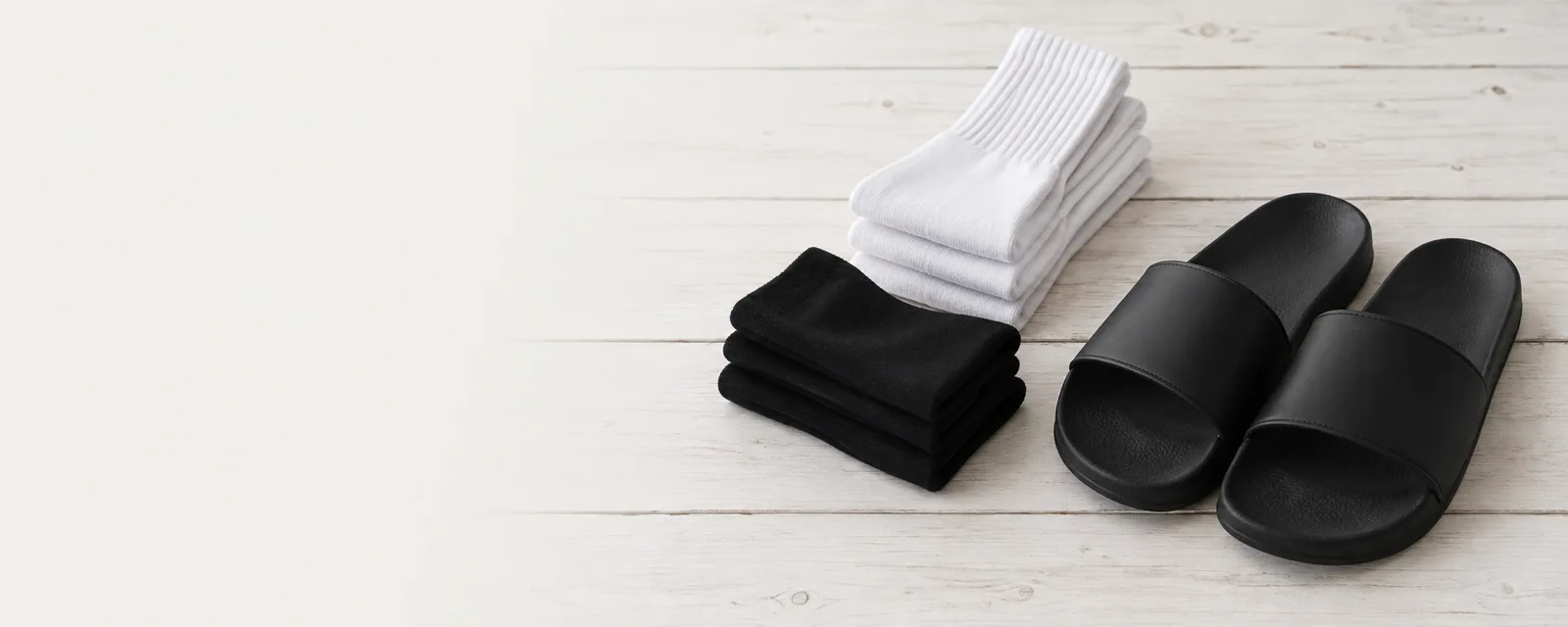Folded socks in black, white and green