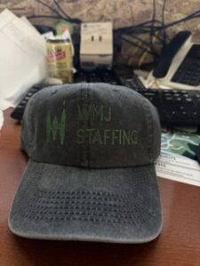 Grey cap embroidered with the WVU Staffing logo