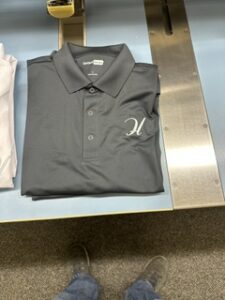 Grey polo shirt with a small embroidered left chest mark