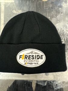 Black beanie embroidered with the Fireside RV Rental patch