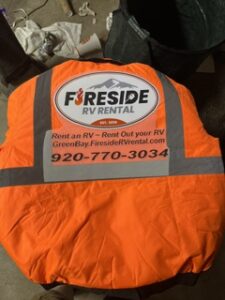 Orange hi-vis vest printed for Fireside RV Rental