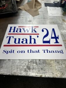 Novelty yard sign reading Hawk Tuah 24