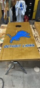 Detroit Lions cornhole board on a trestle