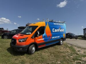 Canfield service van wrapped in orange and blue