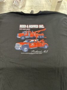 Dark tee printed for Reed & Hoppes Inc of Portland, Michigan